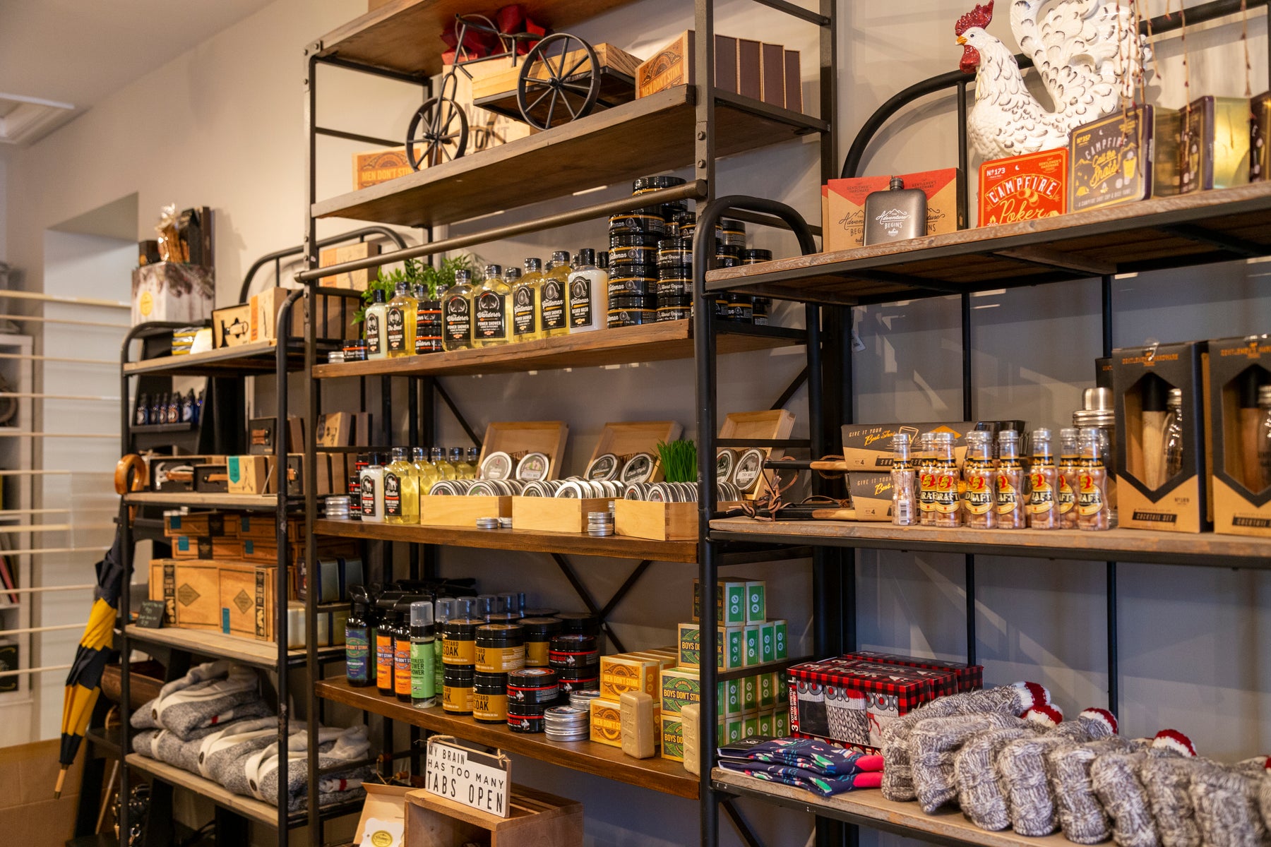 Three shelves filled with various products from Walton Woods Farm.